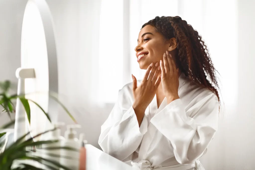 relaxed woman in bathrobe enjoys a spa day utc