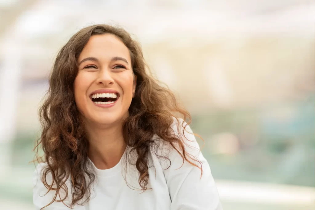 closeup shot of beautiful young woman happily laug utc
