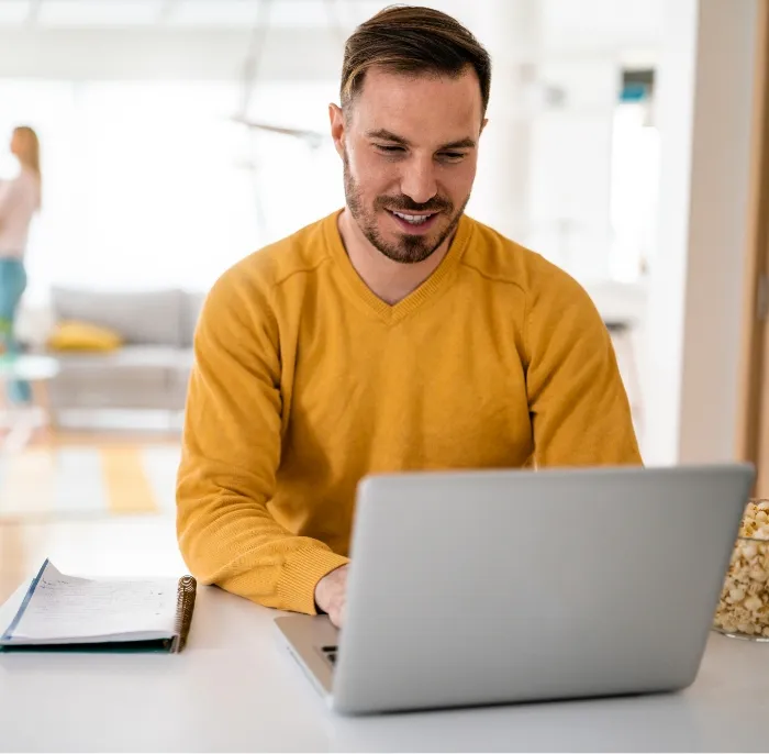 handsome man designer working home using laptop at utc